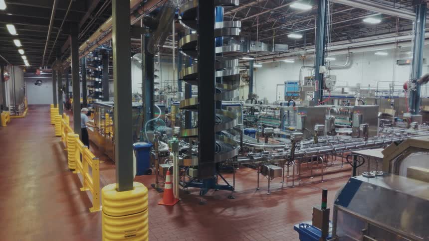 Modern industrial facility with spiral conveyor and automated machinery in safe operation