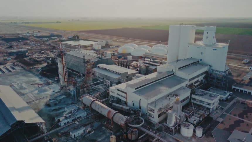 Aerial view of a factory facing agricultural fields