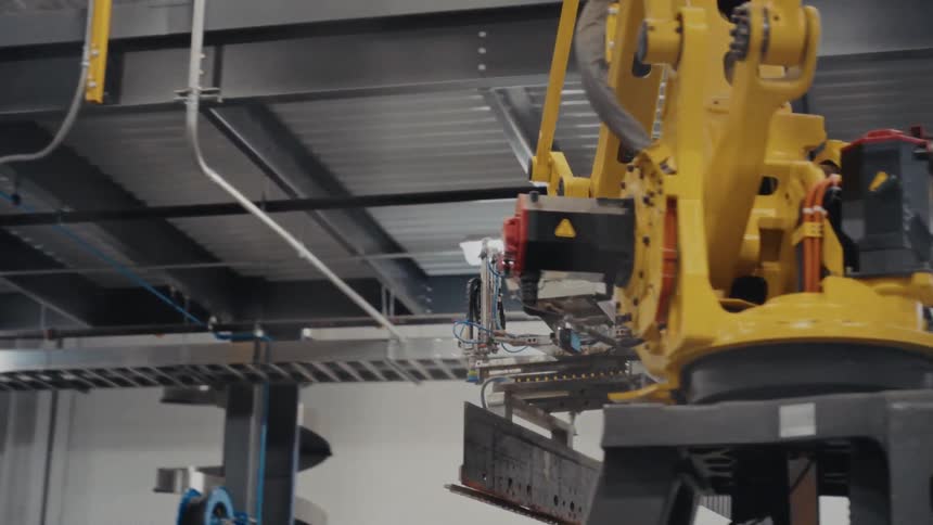 A robot moving around boxes in a warehouse