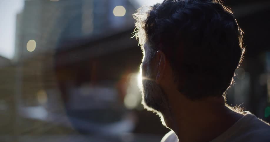 Bearded man observing an urban city