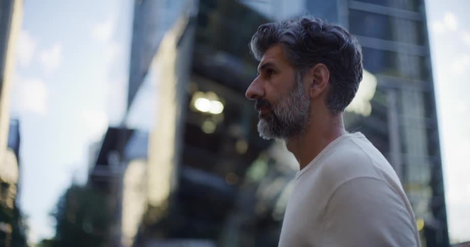 A man walking outdoors in a city