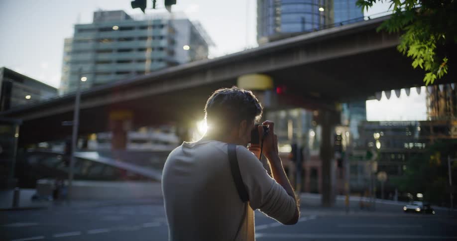 The man is photographing the city