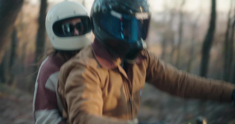 A man and woman riding on a motorcycle