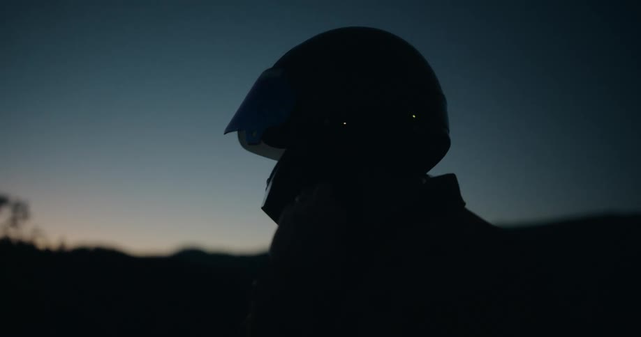 The man puts on his helmet