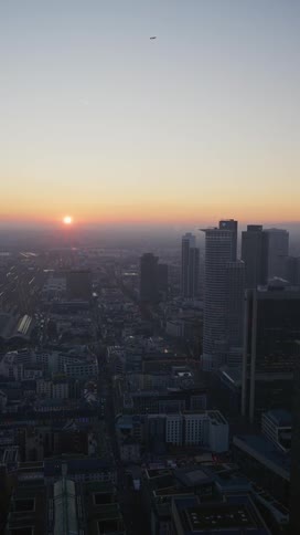 Panorama of a metropolis with the sunrise on the horizon