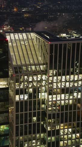 A high rise office building in a metropolitan city at night