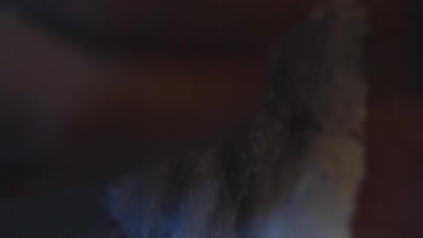 A person putting chalk on their hands