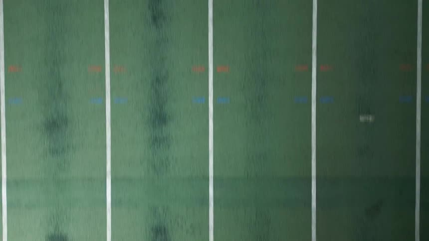 Man running at high speed on an athletics track