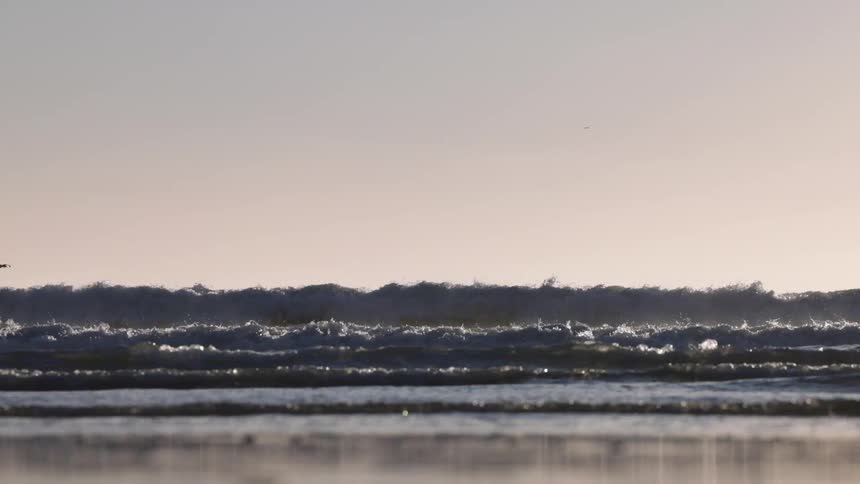 A view of waves from the beach