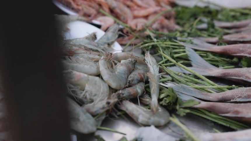 Close up of seafood preparation outdoors during daytime