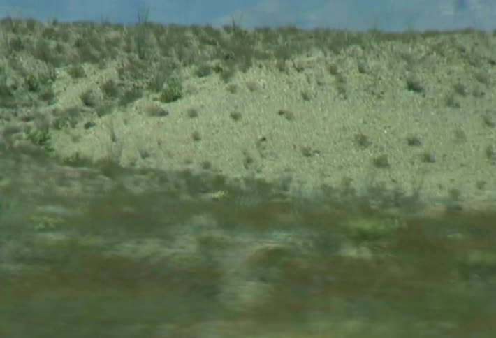 The vehicle passes the mountain range