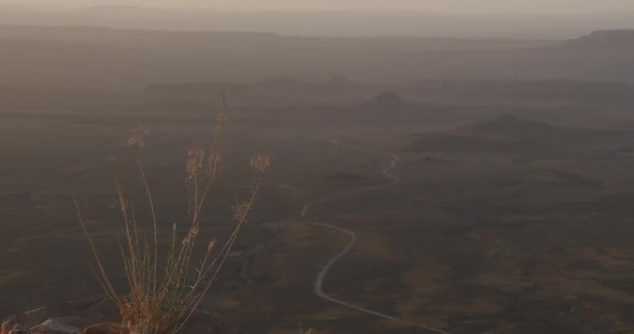 A view of a landscape with some small hills in it