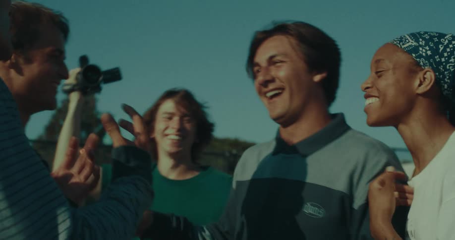 Group of young people interacting outdoors in an urban setting