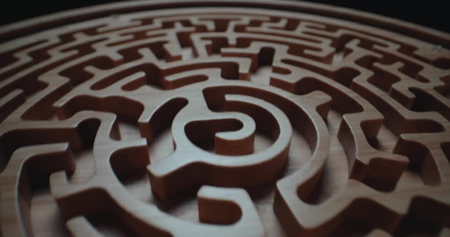 A close up of a wooden carved maze