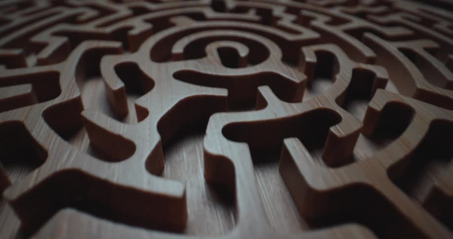 Circular wooden maze with carved channels and visible texture