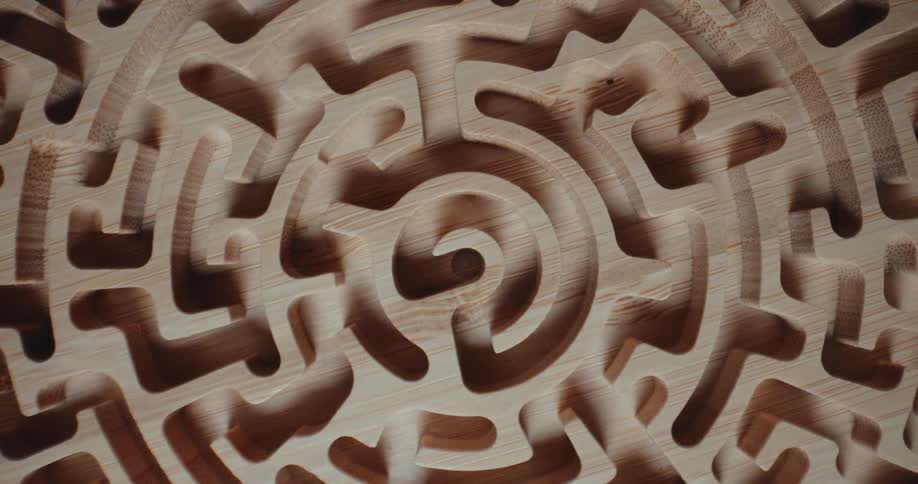 A wooden carved maze