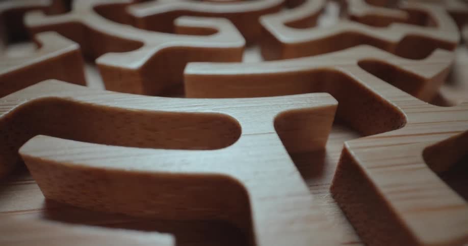 The small wooden maze is spinning