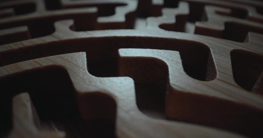 A close up of a wooden carved maze