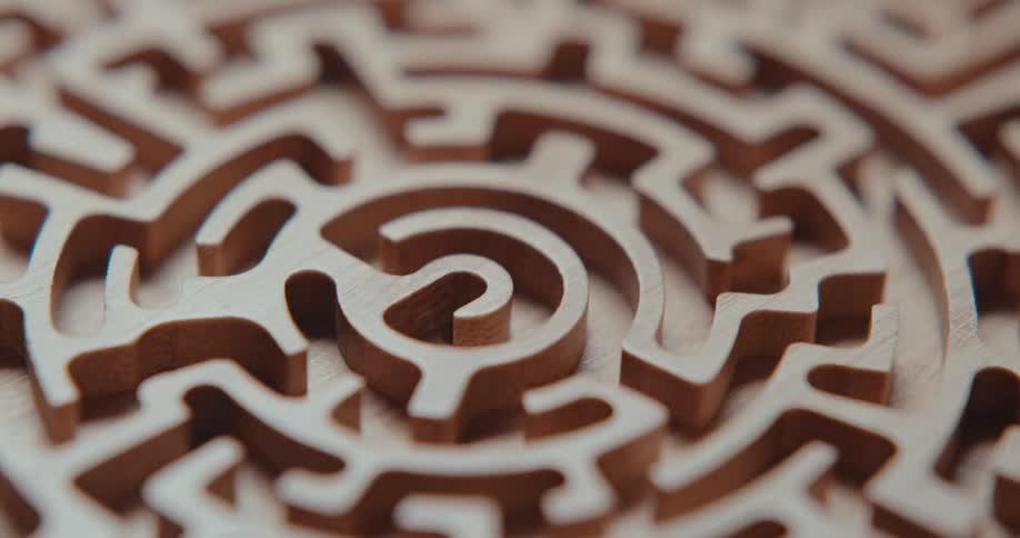 Wooden labyrinth with carved channels