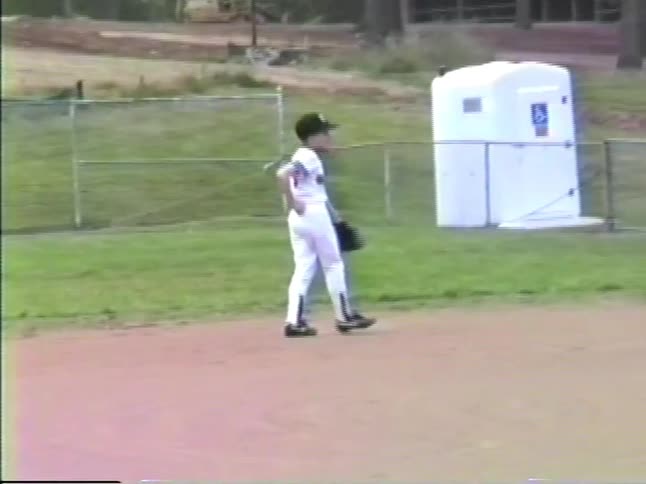 The child catches the baseball and throws it