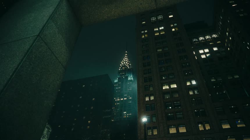 A view of tall buildings in a city at night