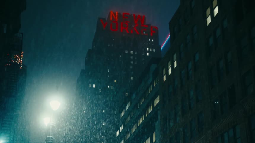A rainy night in a city street with a glowing new yorker sign atop a building and streetlights reflecting off the falling rain