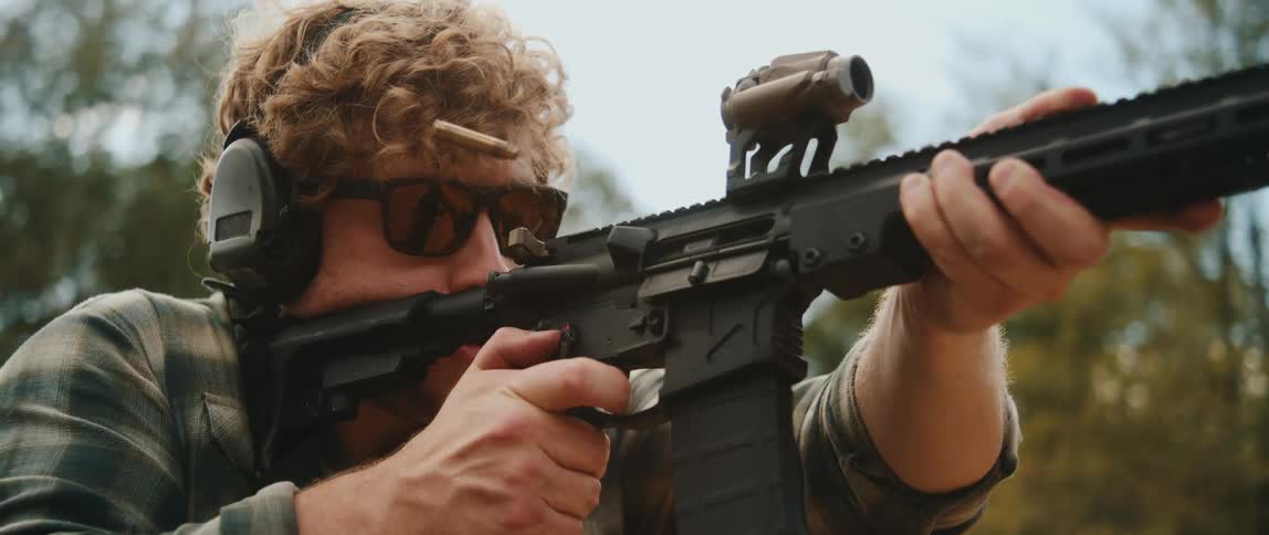 Man focused on firing a gun