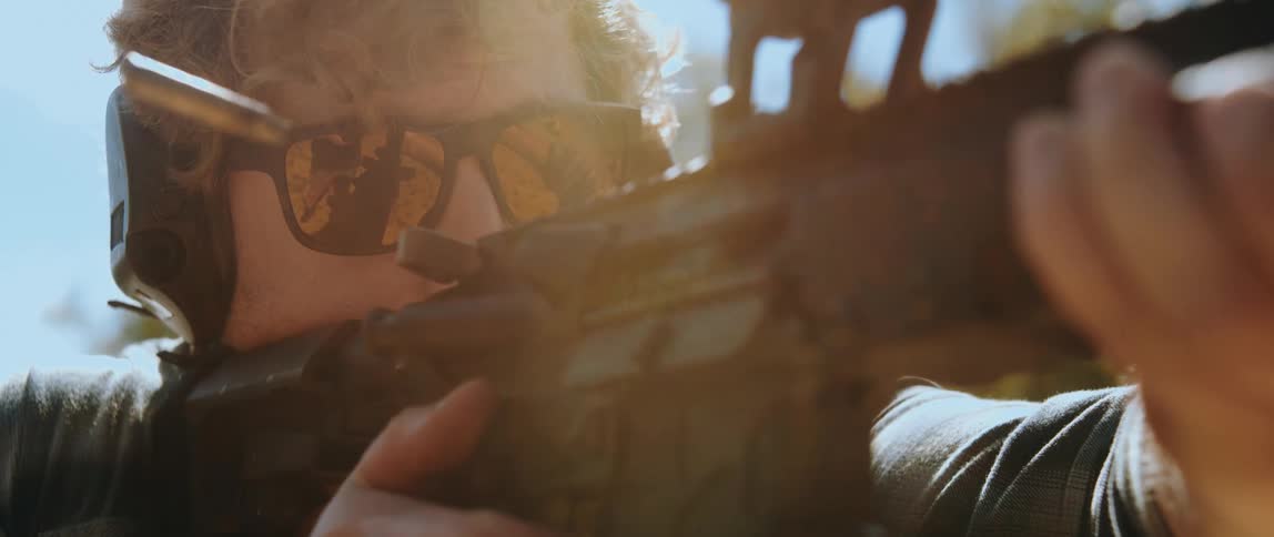 A man shooting an ar15 outdoors