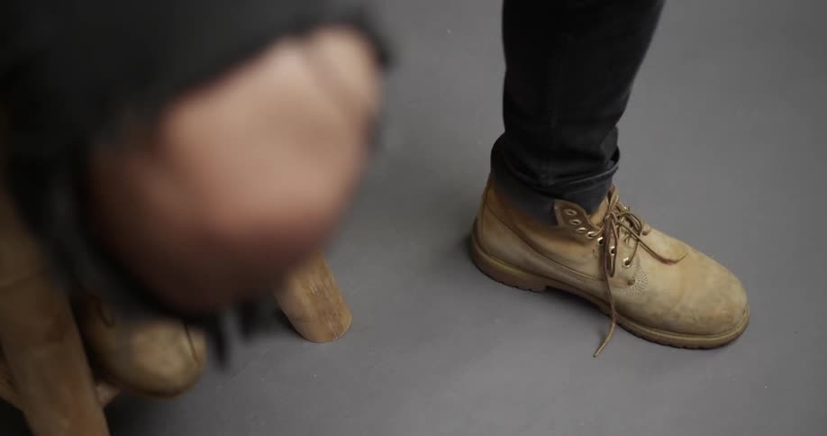 A musician taps their foot to the beat