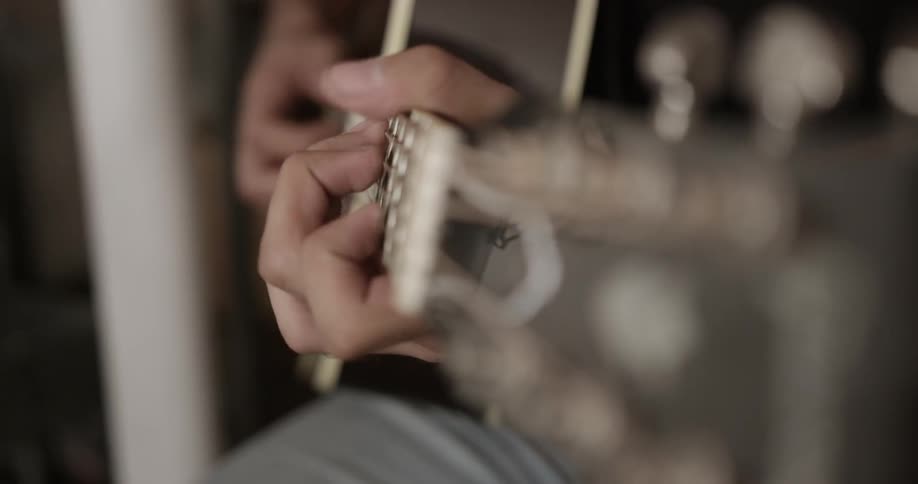 A person is playing a guitar