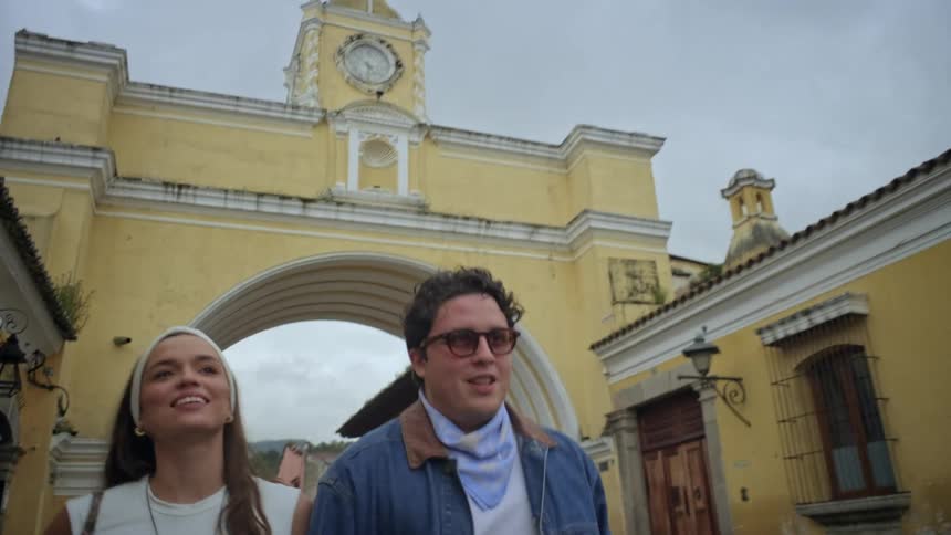 A man and woman walking in a city