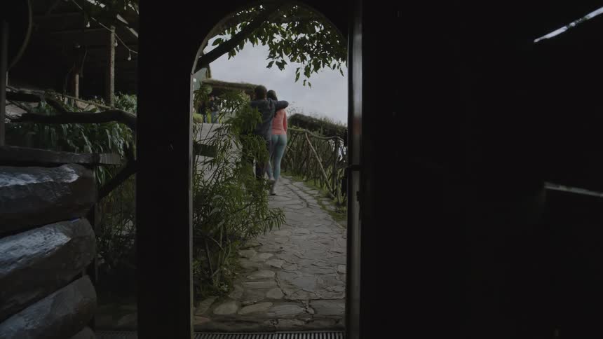A man and woman walking outdoors