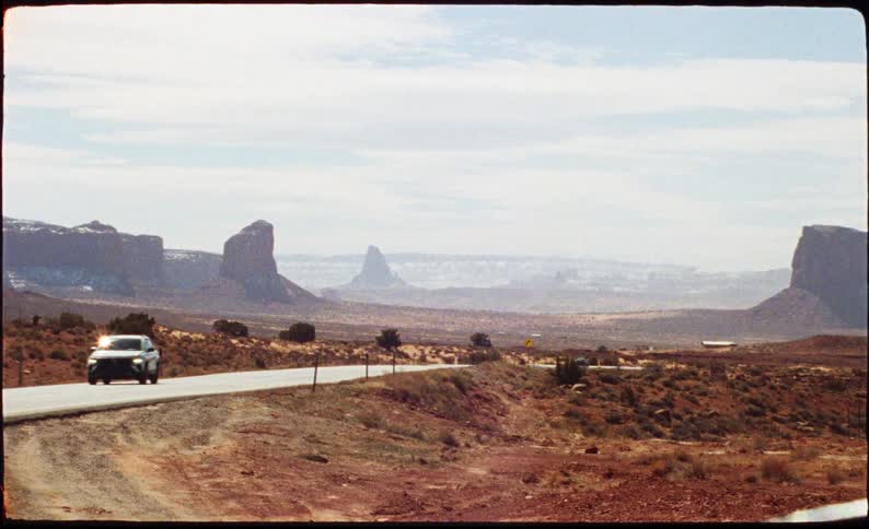 A car driving through a desert area