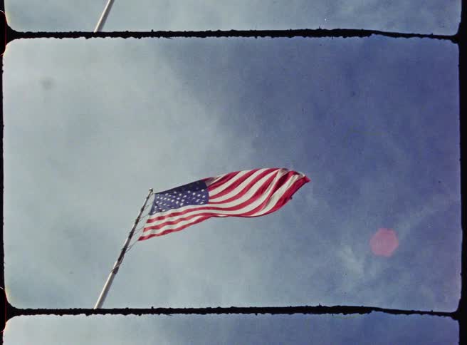 View of the american flag against a cloudy sky