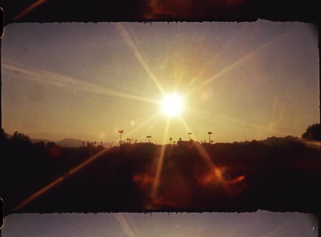 Landscape in a field with the sun on the horizon