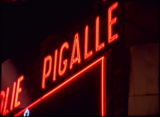 A view of signs on a building at night
