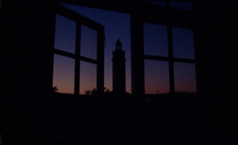View from a window with a tower in the background