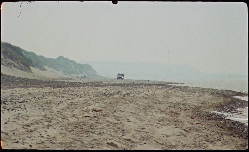 Vehicle moving on the sand at the seaside