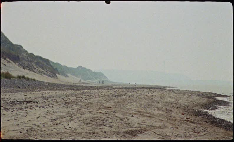 The beach is covered in heavy fog