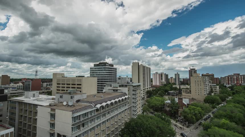Vehicles drive down city streets