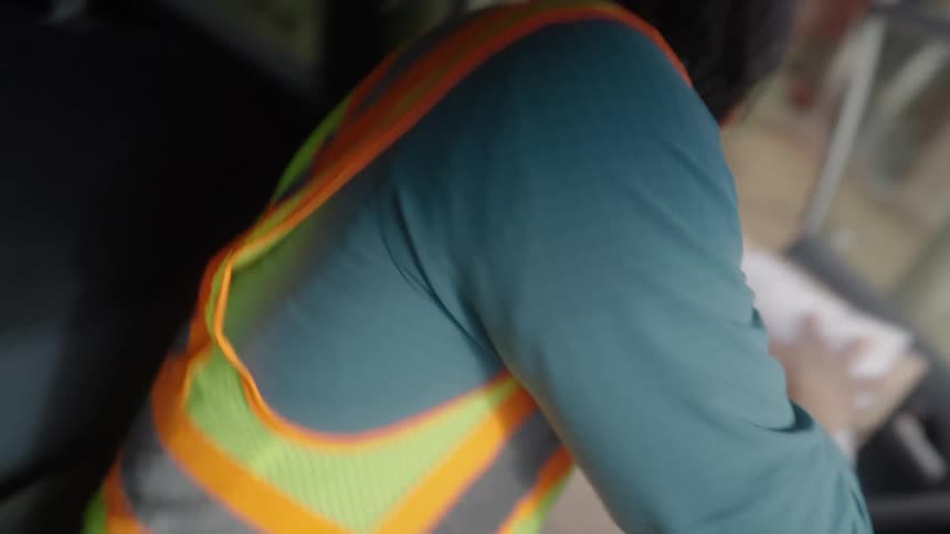 The man delivers packages from his car