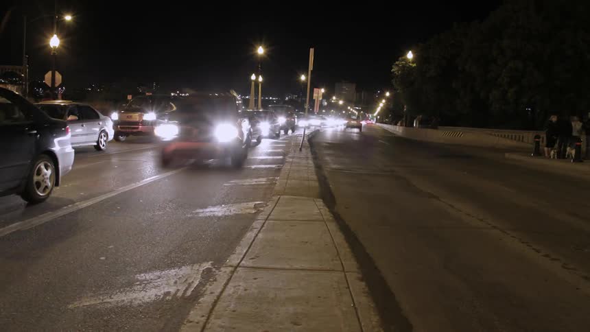 Time lapse of traffic moving through a large city at night