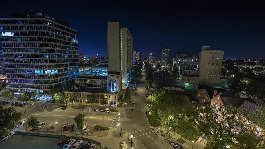 Cars drive on the city road at night