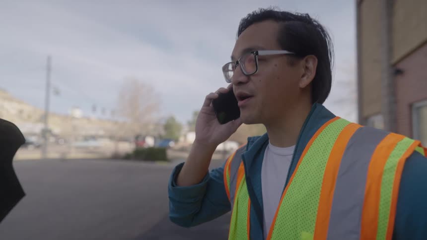 The man is yelling into his cell phone