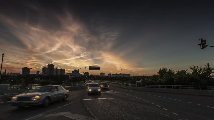 Cars commute down this road at dawn