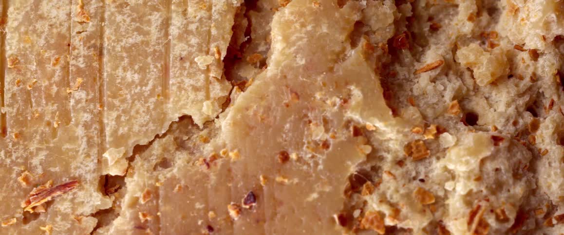 Extreme closeup of an abstract brown textured food