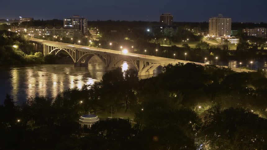 Cars travel over this small bridge at dawn