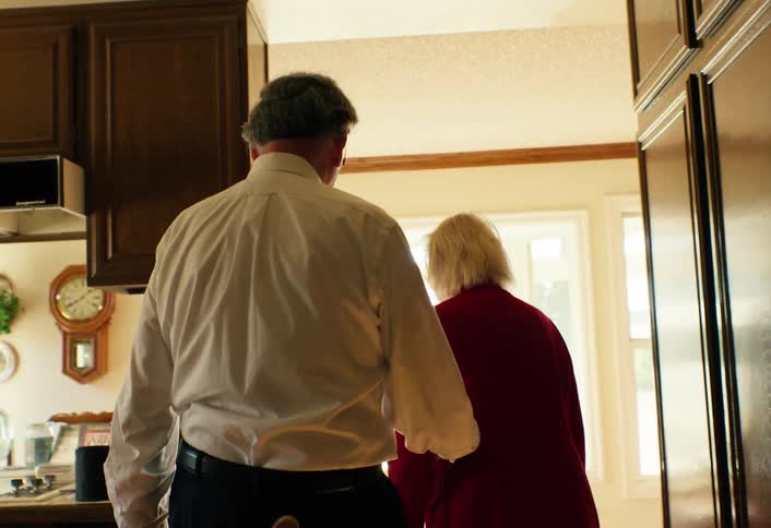 The man and woman walk in the home