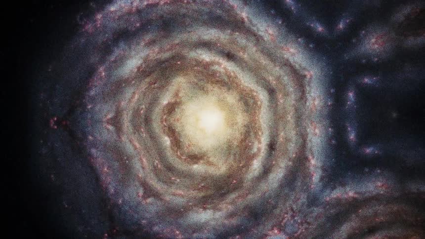 Layers containing copper and gray rotate around a glowing center