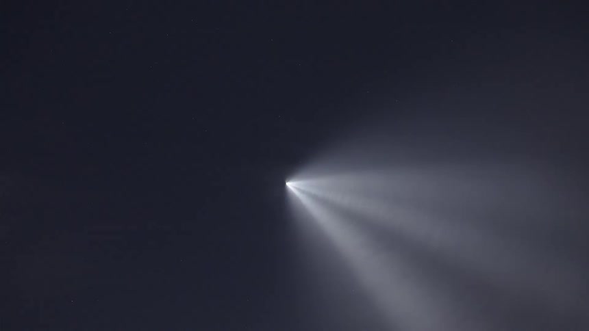 A rocket ascends into the thinning air, while its exhaust plume expands outward into a massive, bulbous cloud
